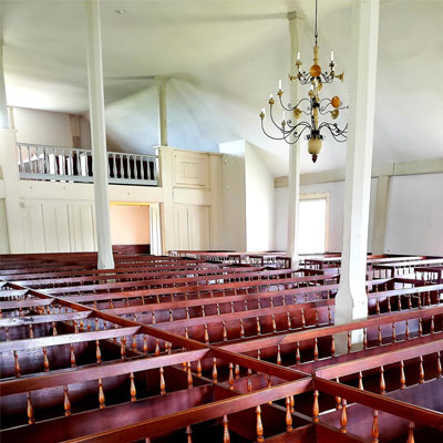 View of pews in Bishop Hill Colony Church 