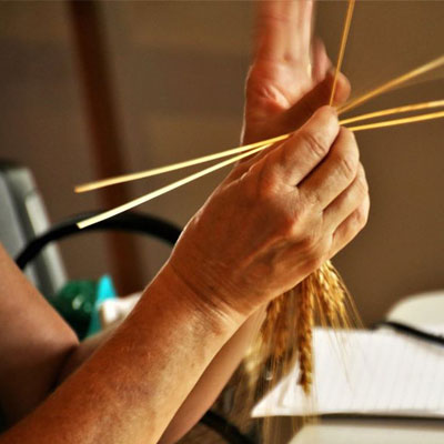Wheat weaving demo in Bishop Hill